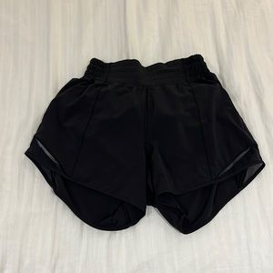 Black Lululemon hotty-hot shorts. 4” version. Size 4
